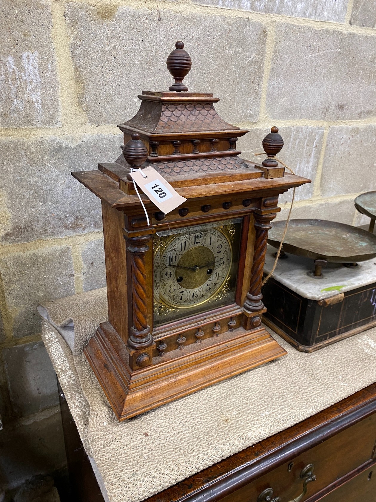 An early 20th century walnut mantel clock, height 53cm together with a set of Victorian scales